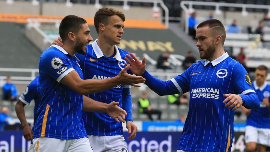 Neal Maupay (left) is congratulated by Solly March (centre) and Aaron Connolly