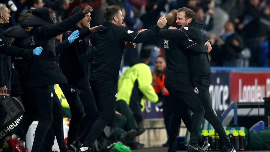 Jan Siewert and his coaching staff celebrate Steve Mounie's late winner against Wolves