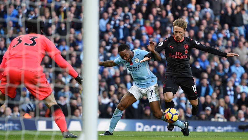 Raheem Sterling and Nacho Monreal tangle