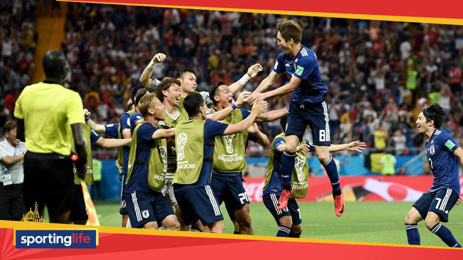 Japan celebrate after taking the lead v Belgium at the World Cuo