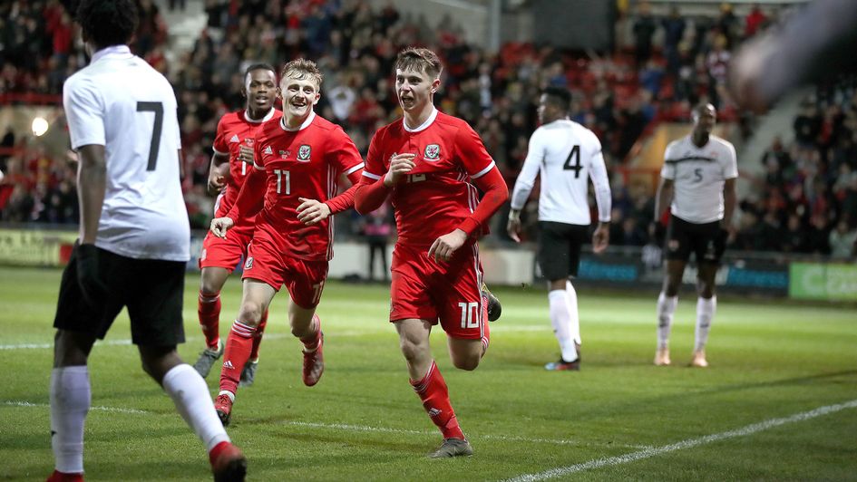 Ben Woodburn celebrates after scoring late on for Wales against Trinidad and Tobago