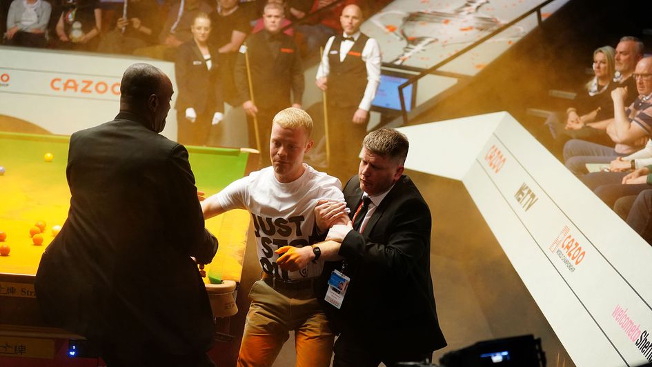 A protestor is taken away at the Crucible