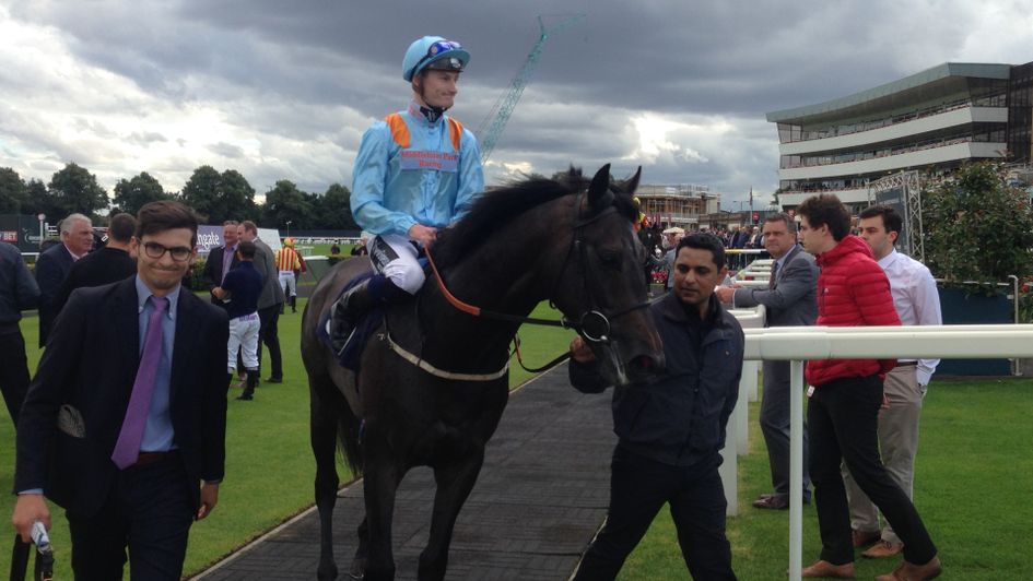 Dark Acclaim is led in after winning at Doncaster