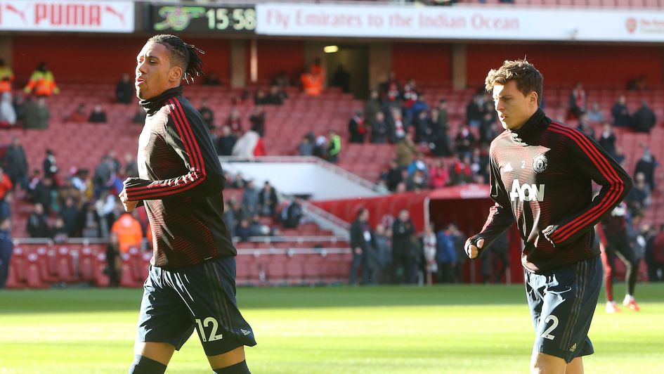 Manchester United duo Chris Smalling and Victor Lindelof warm up ahead of their Premier League clash with Arsenal