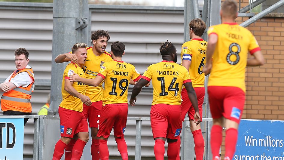 Matt Crooks celebrates with his Northampton teammates