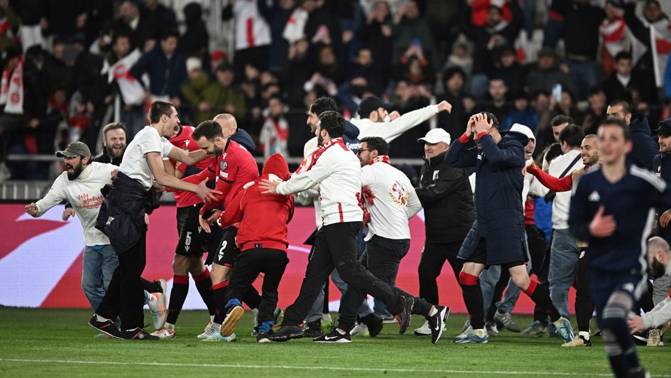 Georgia fans and players celebrate at full-time