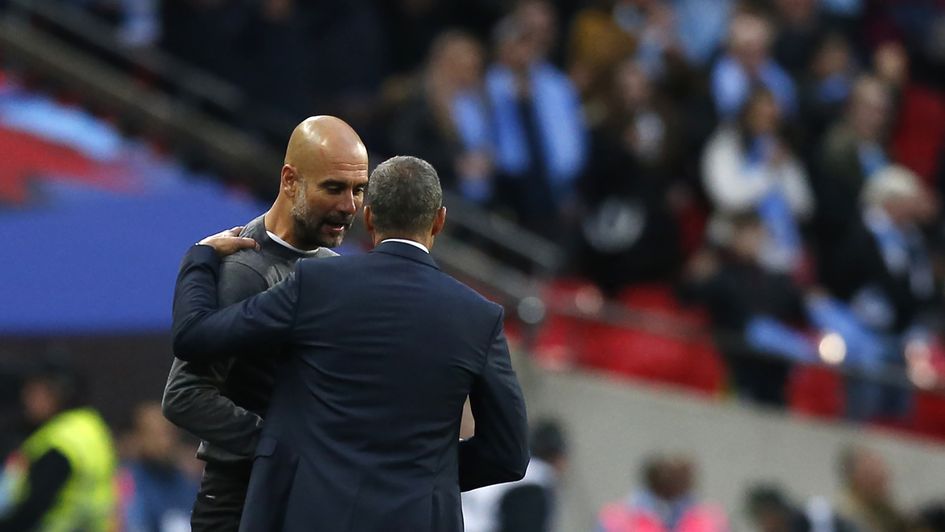 Pep Guardiola (left) and Chris Hughton in conversation after the FA Cup semi-final between Man City and Brighton