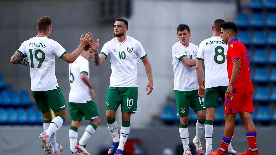 Troy Parrott of Ireland celebrates with teammates after scoring their team's first goal
