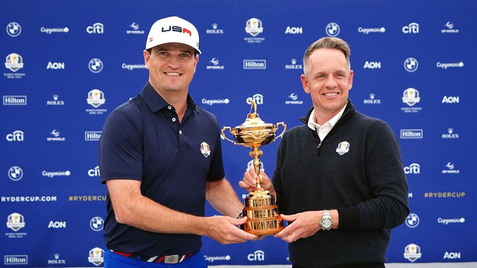 The captains hold the Ryder Cup trophy ahead of the 2023 edition