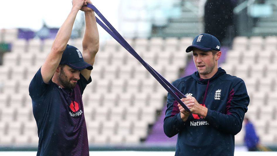 England's Mark Wood (left) and Chris Woakes train in the rain