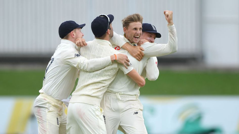Joe Root is mobbed after picking up another wicket