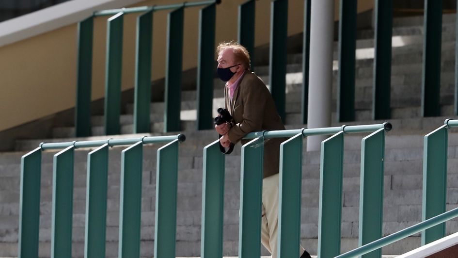 Dermot Weld watches the action from the stands
