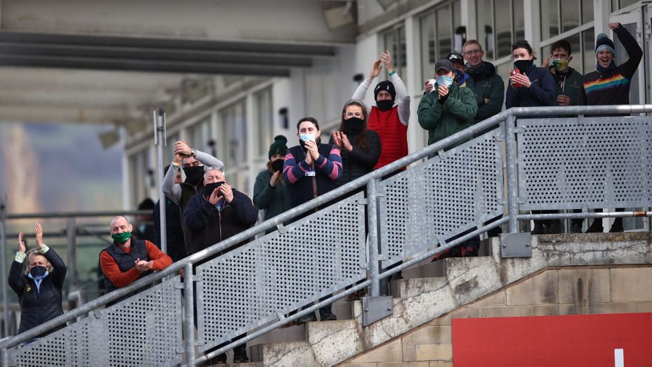 Stable staff applaud The Shunter back to the winners' enclosure