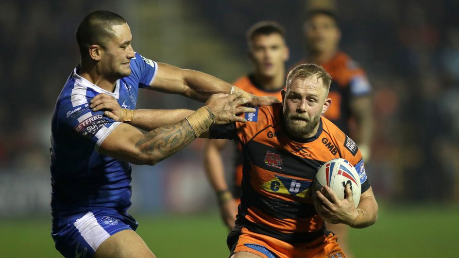 Castleford Tigers' Paul McShane (right) is tackled by Hull KR's Weller Hauraki