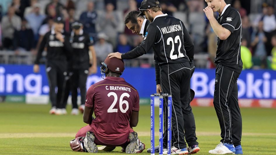 New Zealand players console Carlos Brathwaite after the match