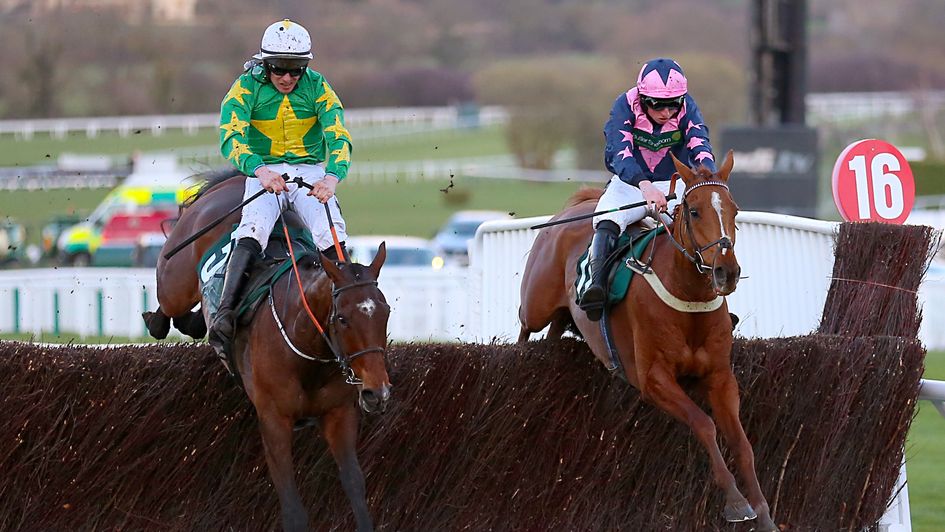 Discorama (left) and Le Breuil jump the last at Cheltenham