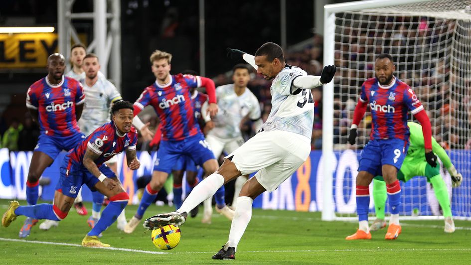 Joel Matip directs a shot towards goal