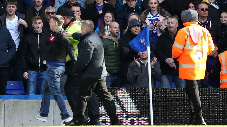 The fan who attacked Aston Villa's Jack Grealish is escorted off the pitch