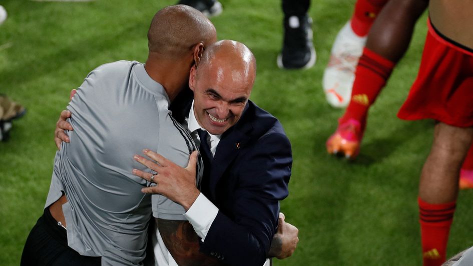 Roberto Martinez celebrates with Thierry Henry