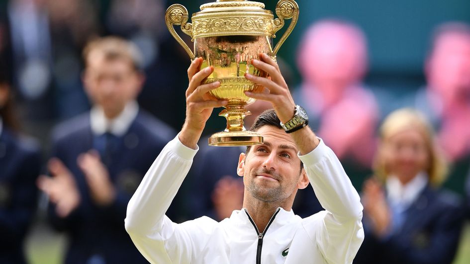 Novak Djokovic lifts his fifth Wimbledon trophy