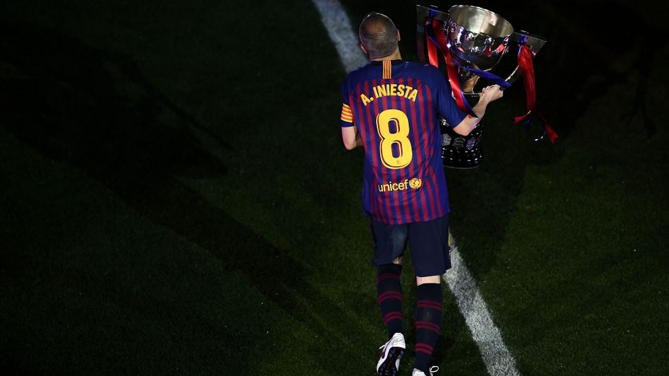 Andres Iniesta with the La Liga trophy