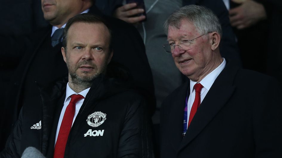 Sir Alex Ferguson (right) watches Manchester United's Champions League last 16 clash at PSG with executive vice chairman Ed Woodward