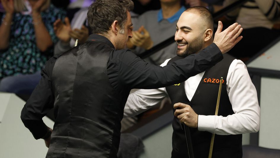 Ronnie O'Sullivan and Hossein Vafaei share a warm embrace