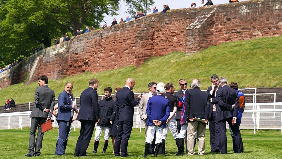 Jockeys, trainers and ground staff during a course inspection after race one at Chester