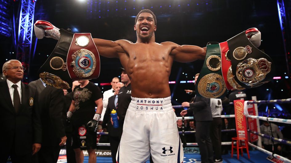 Anthony Joshua with his belts