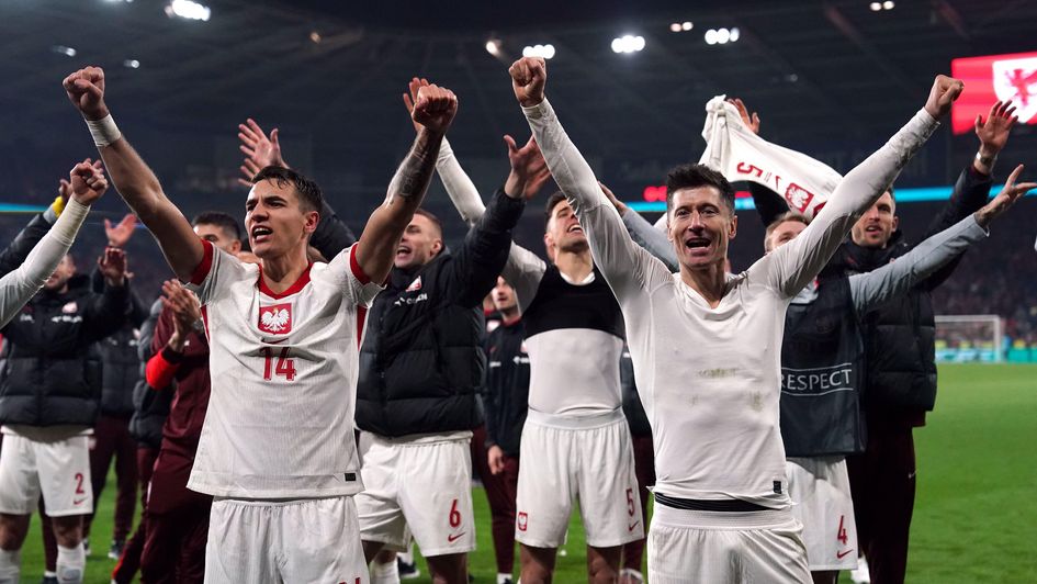 Poland's Robert Lewandowski, Jakub Kiwior and team-mates celebrate