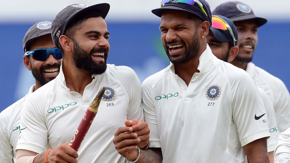 Virat Kohli celebrates with his team-mate Shikhar Dhawan.