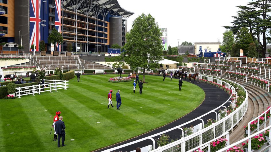 Jockeys and trainers but no owners in the parade ring at Royal Ascot