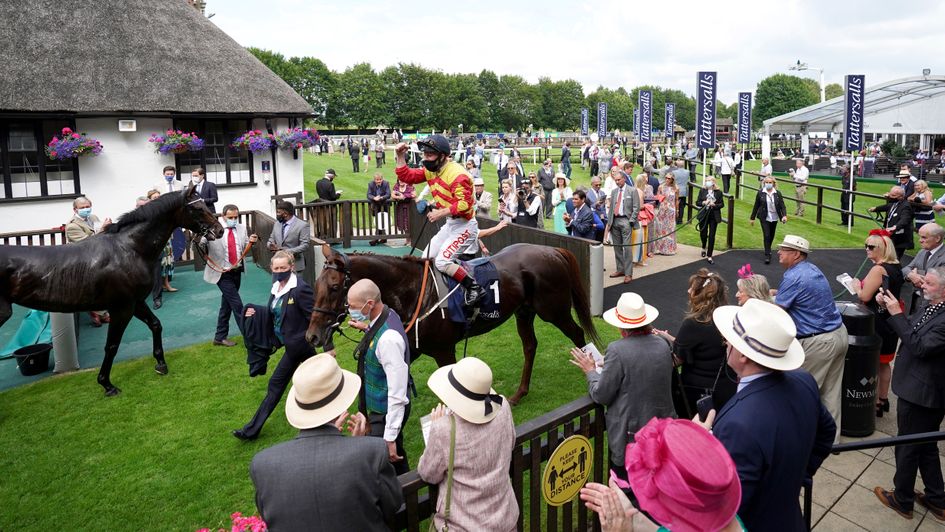 Sir Ron Priestley is cheered in on the July Course