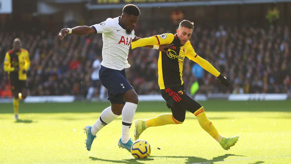 Serge Aurier of Tottenham tackles with Gerard Deulofeu