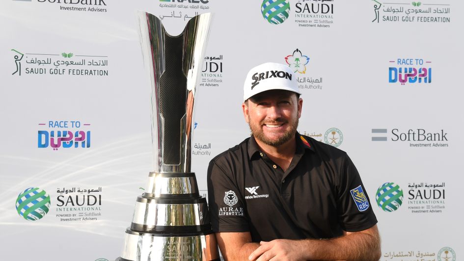 Graeme McDowell celebrates with the trophy