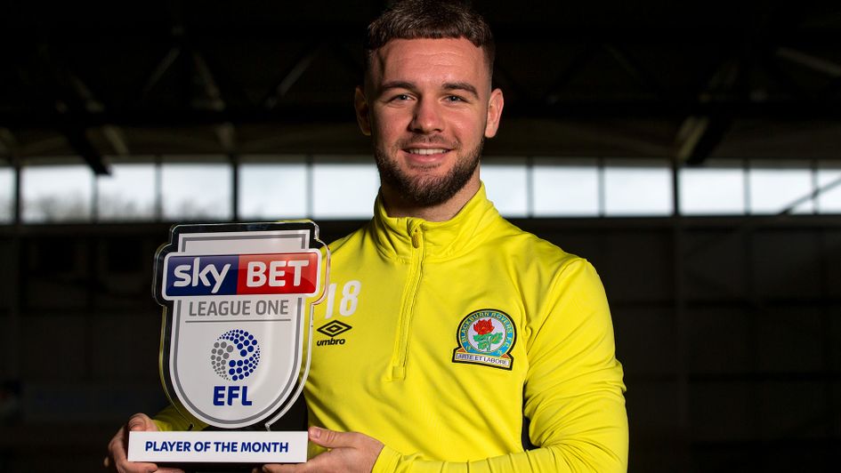 Adam Armstrong collects the Player of the Month award