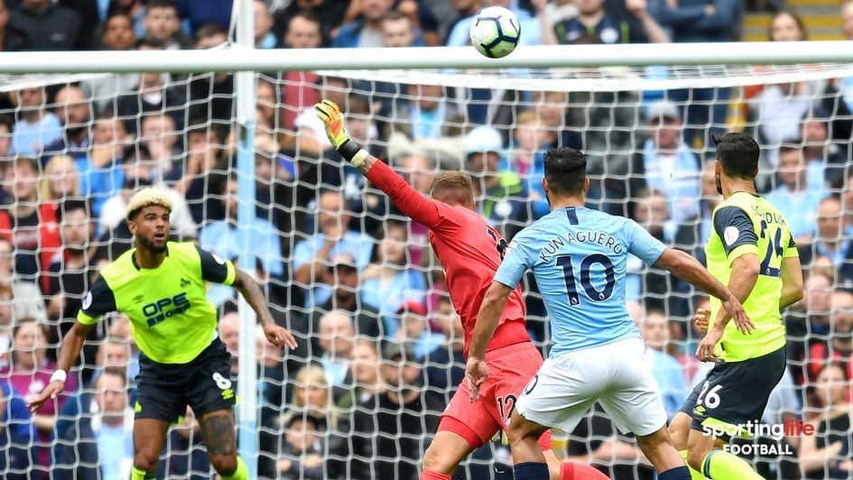 Sergio Aguero scores for Manchester City against Huddersfield