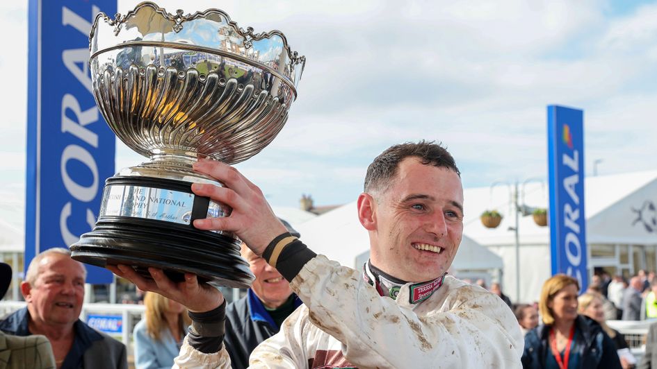 Sean Houlihan celebrates with the Coral Scottish Grand National trophy