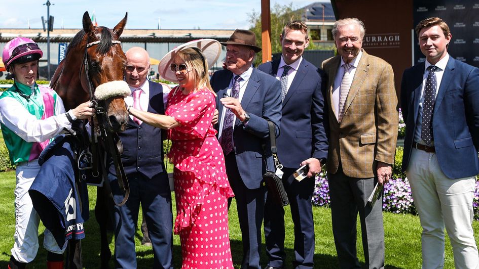 Dermot Weld (second right) celebrates Purview's win
