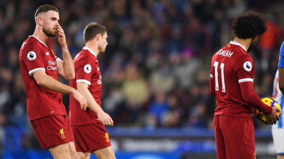 Jordan Henderson in discussion with Mohamed Salah