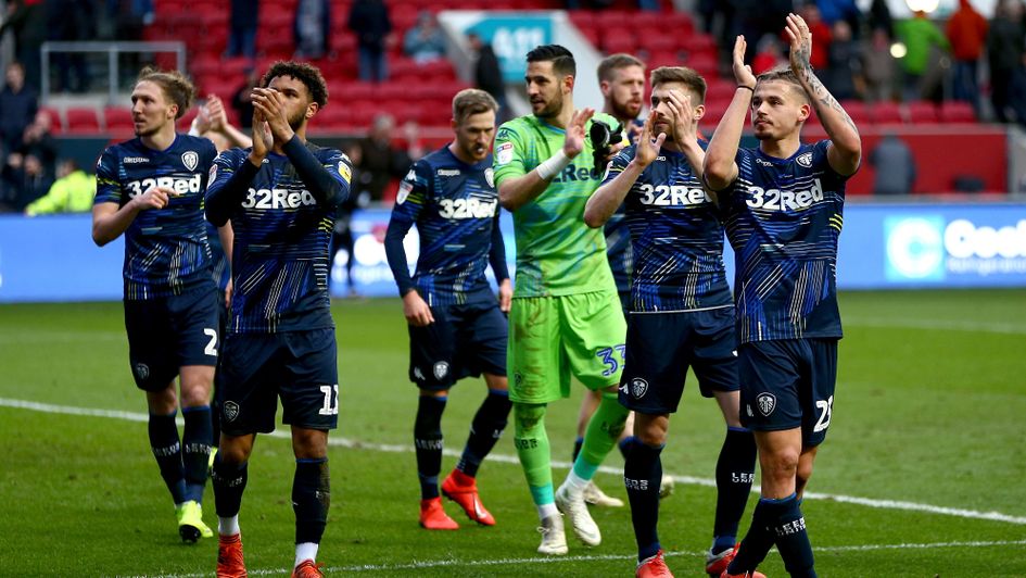 Leeds players salute their fans after their win at Bristol City