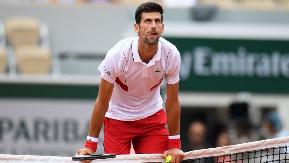 Novak Djokovic: The Serbian star leans on the net during the French Open