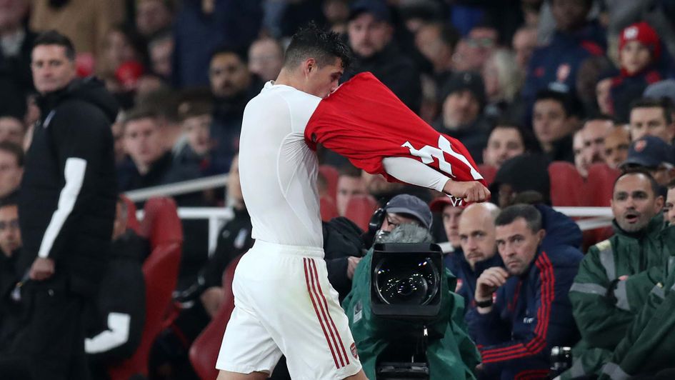 Granit Xhaka takes his shirt off after being booed by his own Arsenal fans at the Emirates