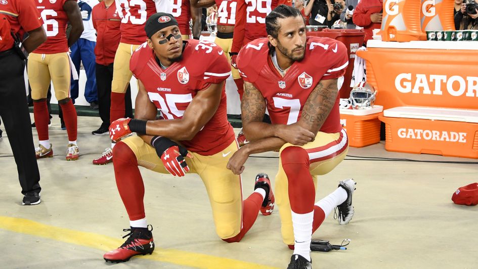 Colin Kaepernick (r) and Eric Reid, then of the 49ers, protest during last season