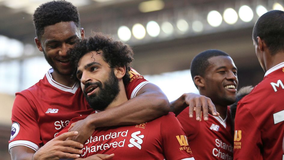 Mohamed Salah enjoys Liverpool's third goal