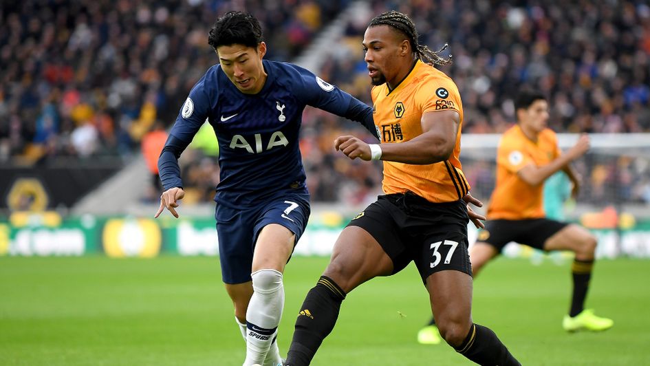 Adama Traore and Son Heung-Min battle for the ball