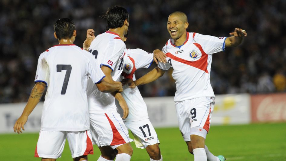 Costa Rica celebrate scoring against Uruguay