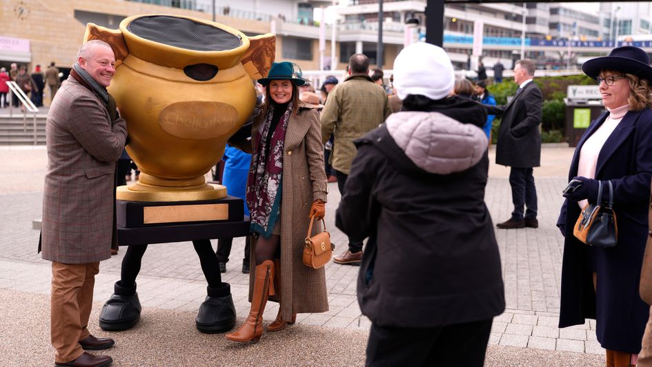 Racegoers posing for photos with Gold Cup