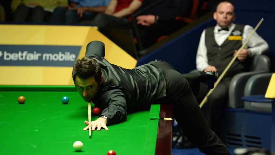 Ronnie O'Sullivan on the charge as Stuart Bingham watches on