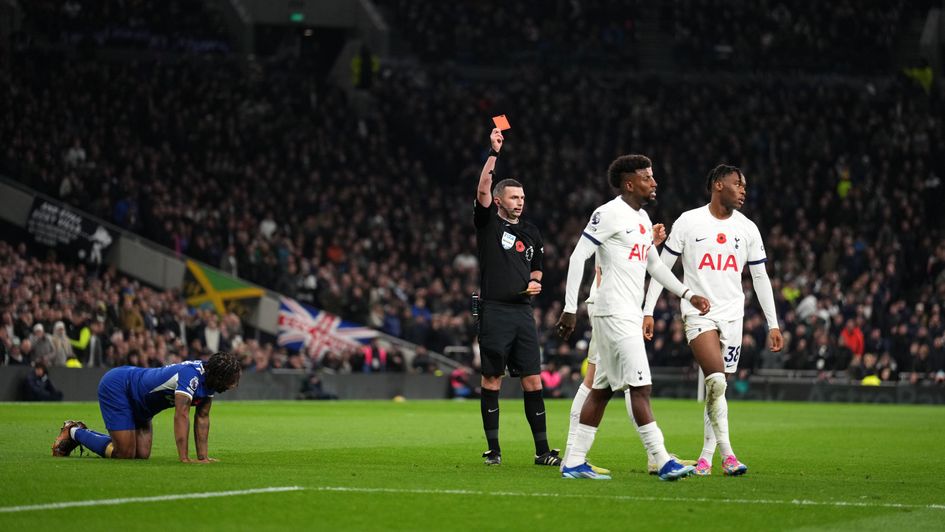 Destiny Udogie is shown a red card